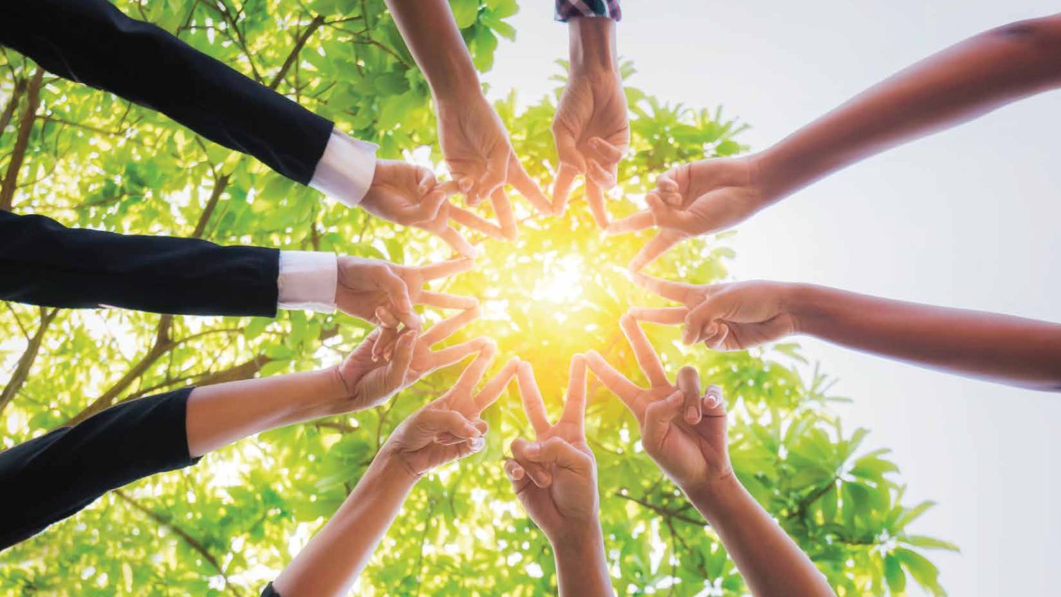 Hands in a circle creating a sun shape