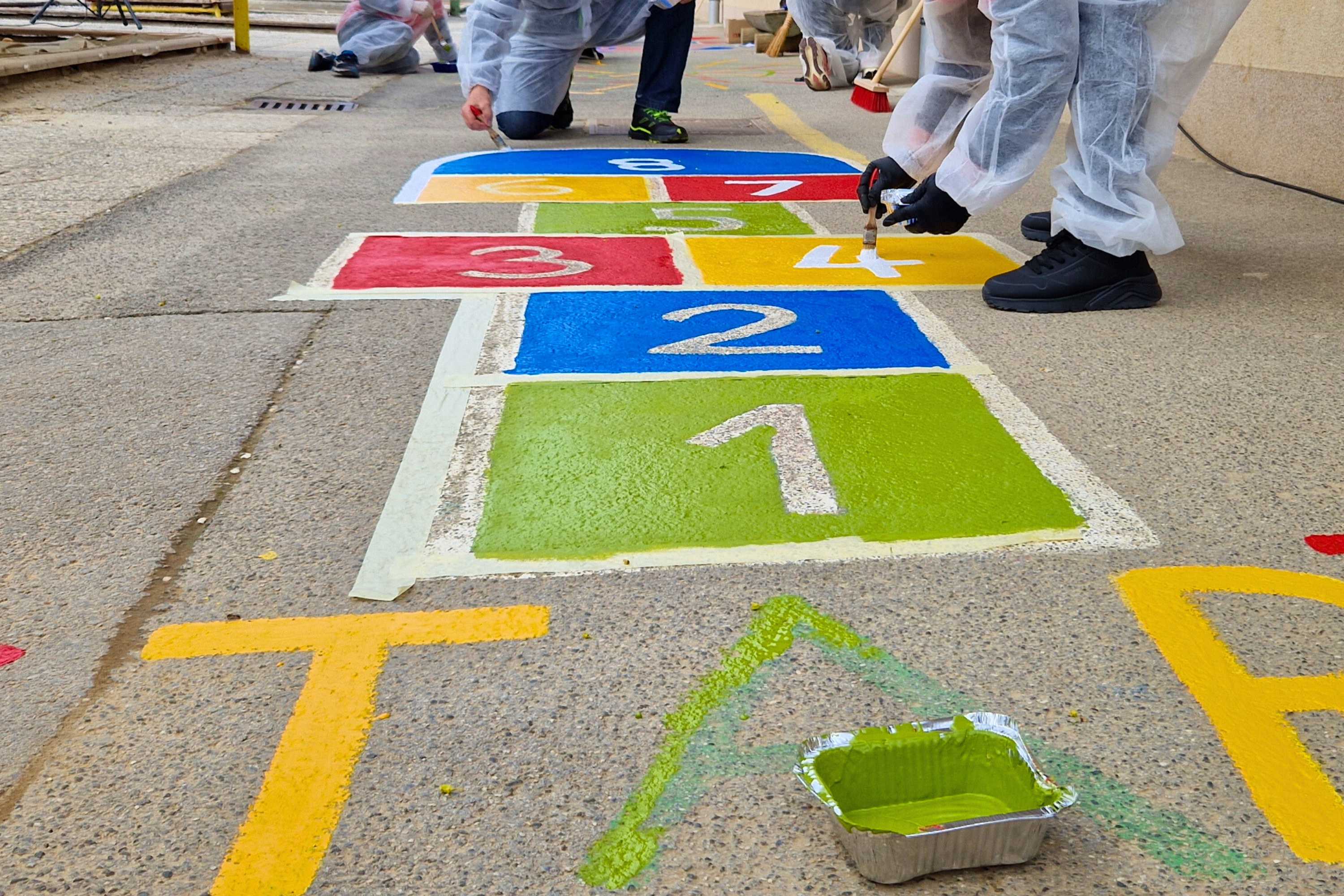 Team building participants painting kids games