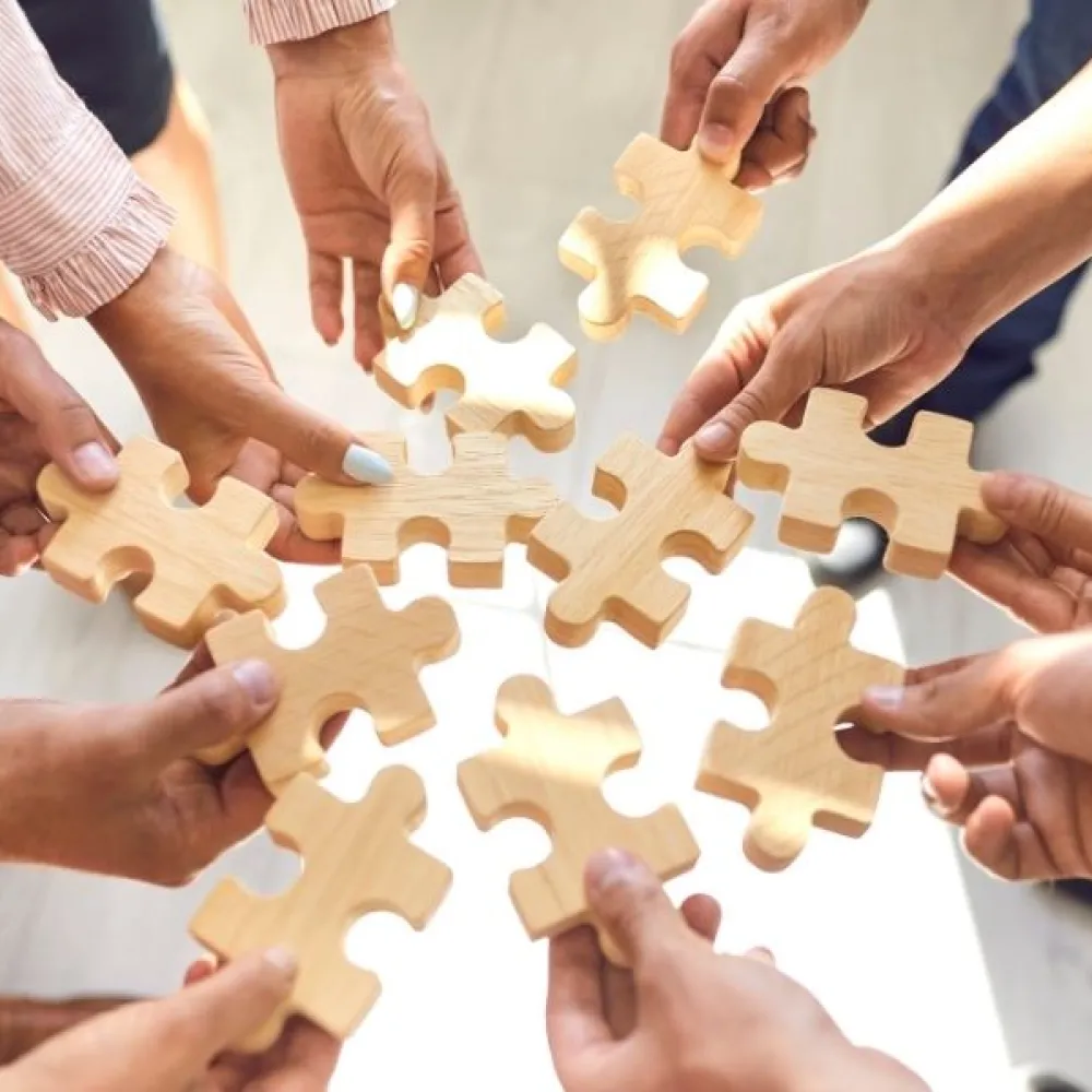 People holding puzzle pieces