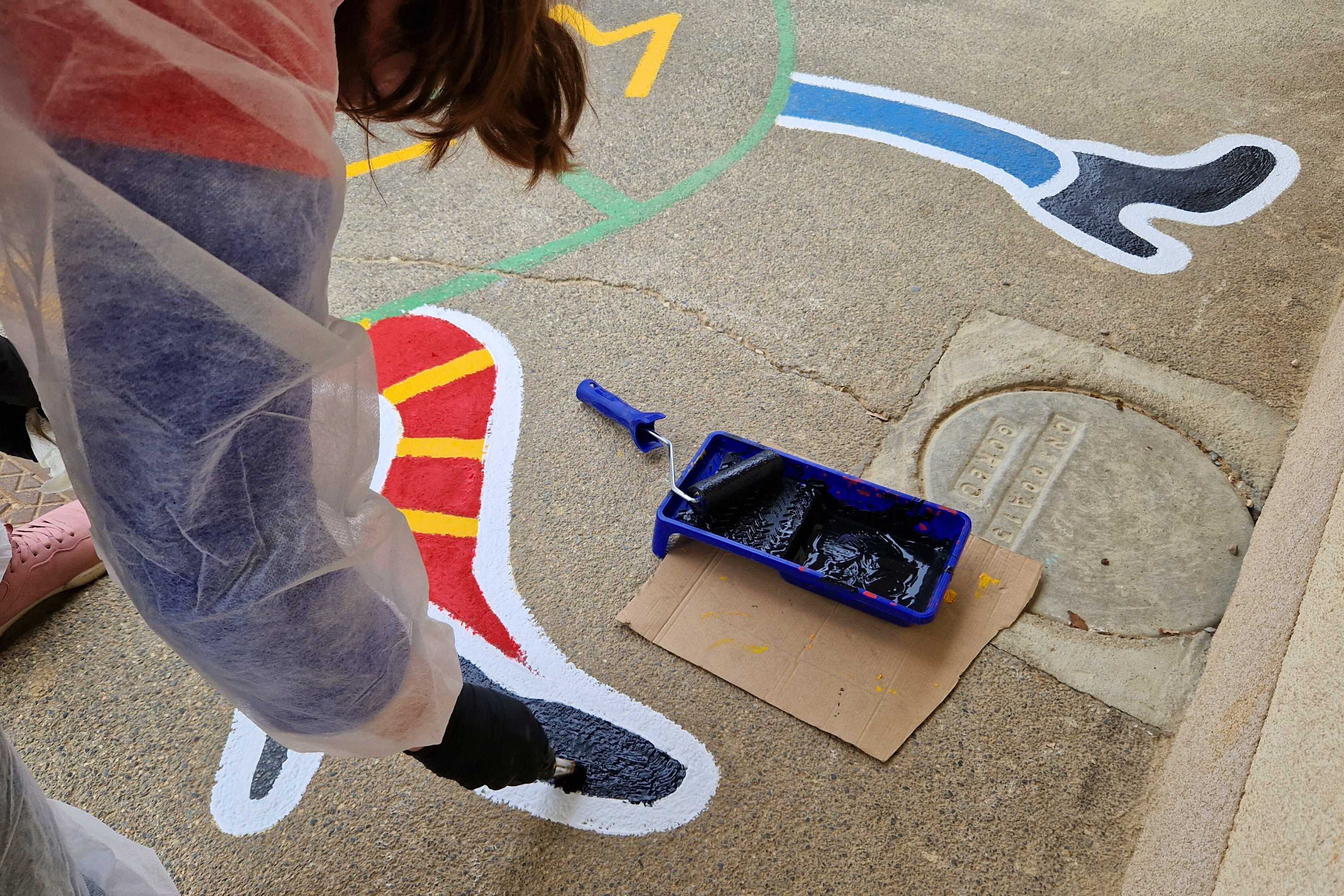 Team building participant painting a kid's game