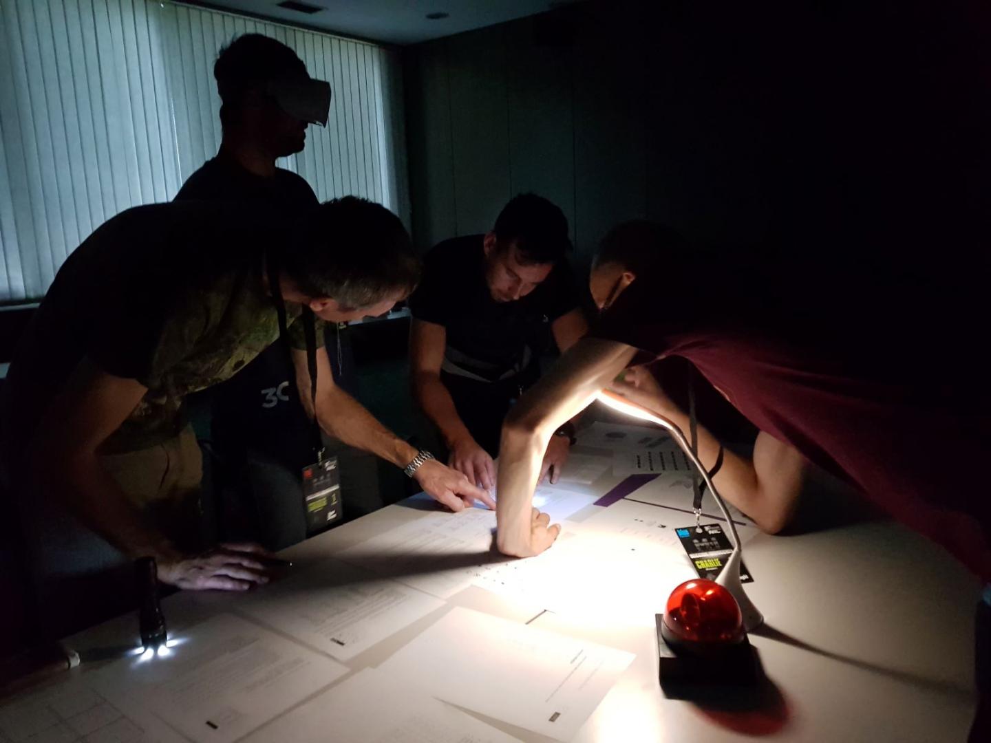 Participants playing a VR teambuilding game